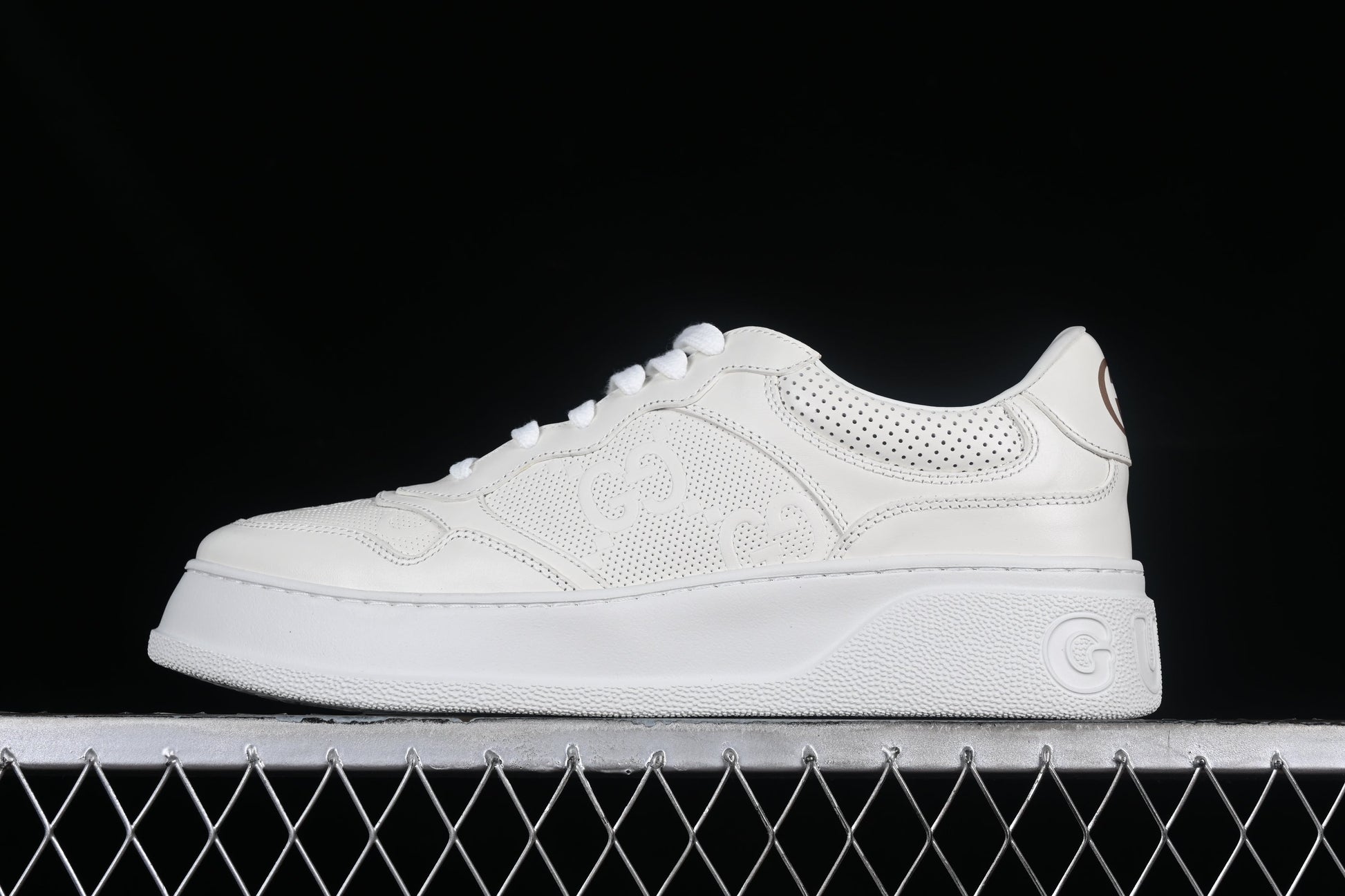 Gucci GG Embossed Leather Sneaker – Black or White XoticBlendz