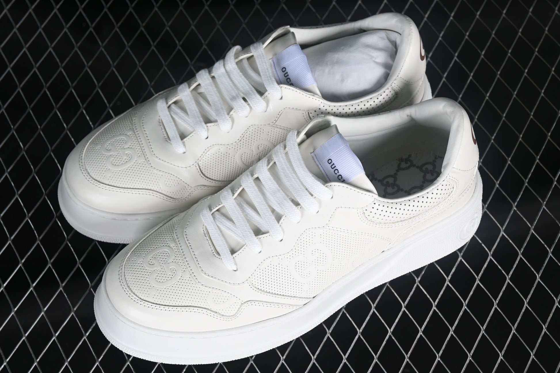 Gucci GG Embossed Leather Sneaker – Black or White XoticBlendz